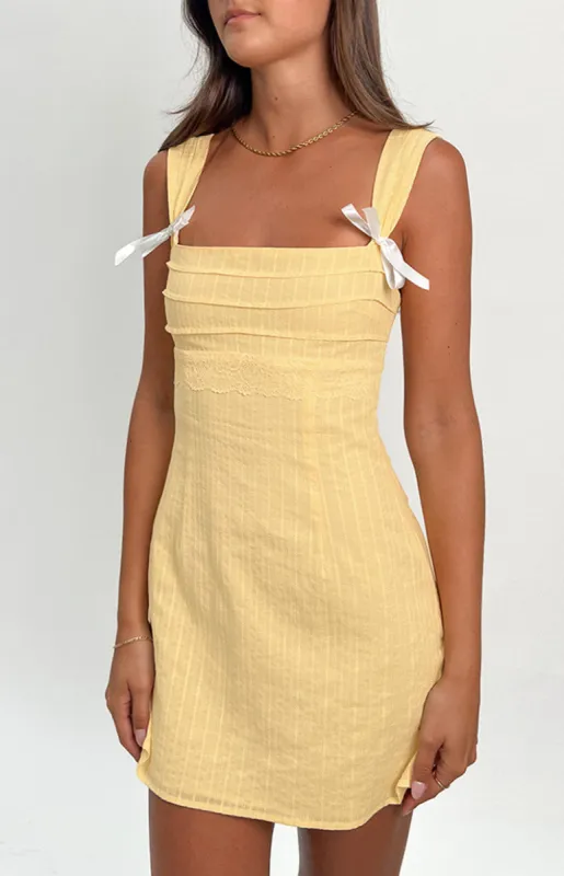 Taylor Yellow Tie Back Mini Dress sold by Beginning Boutique