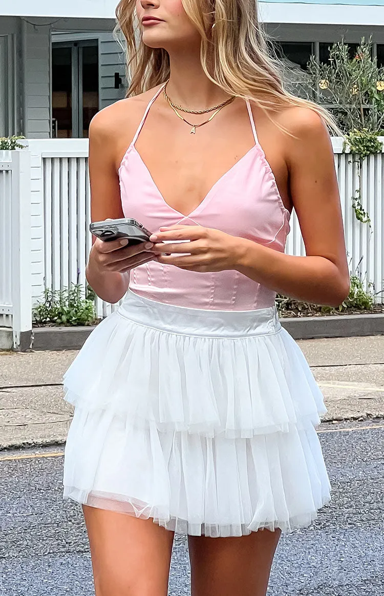 Frosty Ruffle White Mini Skirt sold by Beginning Boutique