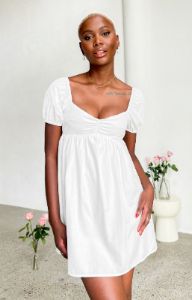 Love Me White Mini Dress sold by Beginning Boutique