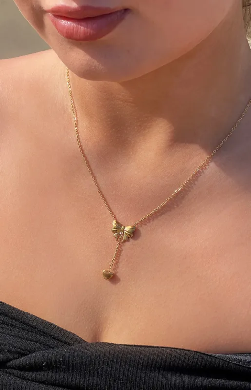 Vincent Gold Bow Necklace sold by Beginning Boutique