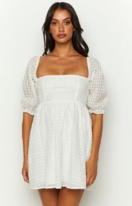 Rubi White Babydoll Mini Dress sold by Beginning Boutique