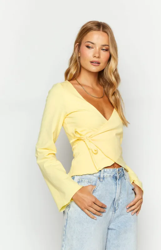 Fantasize Yellow Long Sleeve Front Wrap Top sold by Beginning Boutique
