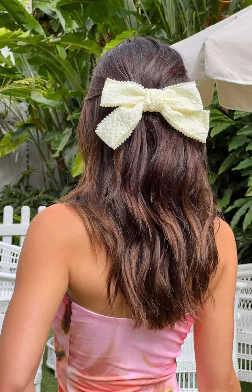Penelope Cream Bow Hair Clip sold by Beginning Boutique