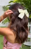 Penelope Cream Bow Hair Clip sold by Beginning Boutique