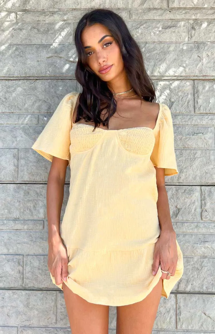 Alexa Yellow Mini Dress sold by Beginning Boutique