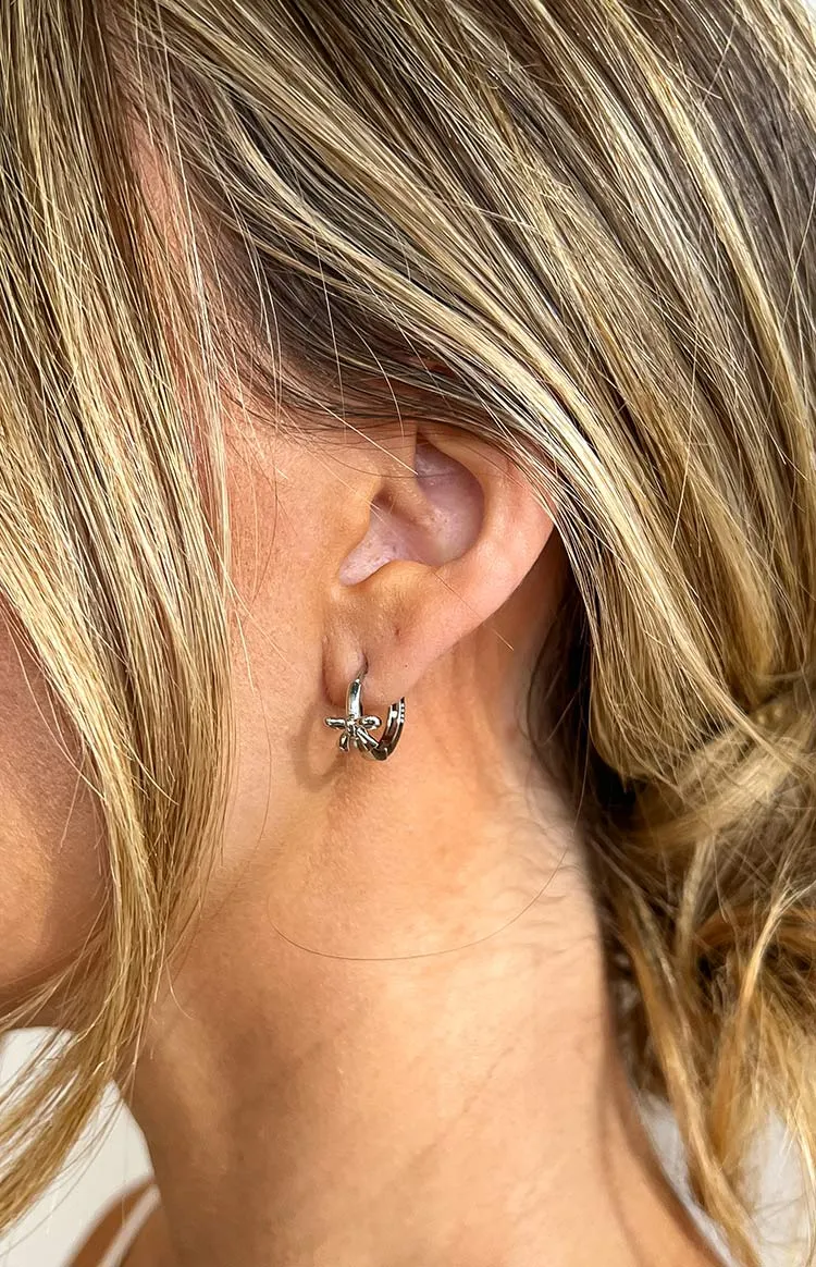 Darling Silver Bow Huggie Earrings sold by Beginning Boutique product image thumbnail 3