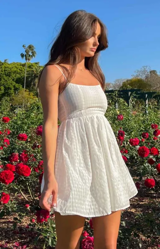 Beyond White Babydoll Mini Dress sold by Beginning Boutique