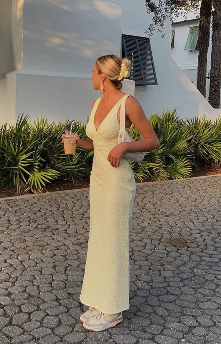 Evilia Yellow Midi Dress sold by Beginning Boutique