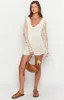 Amlee White Crochet Long Sleeve Mini Dress sold by Beginning Boutique