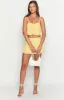 Zyra Yellow Mini Skirt sold by Beginning Boutique