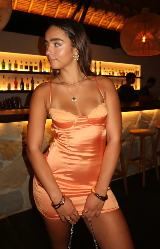 Trouble Orange Mini Dress sold by Beginning Boutique