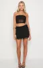 Stay Black Mesh Mini Skirt sold by Beginning Boutique