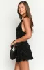 Clancy Black Velvet Mini Skirt sold by Beginning Boutique