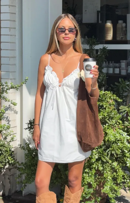 Sweet Pea White Tie Mini Dress sold by Beginning Boutique