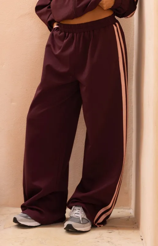 Kosie Burgundy and Pink Stripe Track Pants sold by Beginning Boutique
