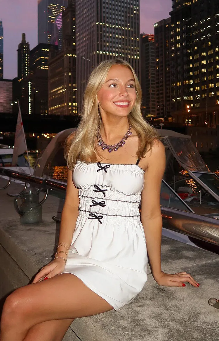 It Girl White Bow Mini Dress sold by Beginning Boutique