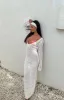 Drea White Backless Knit Maxi Dress sold by Beginning Boutique