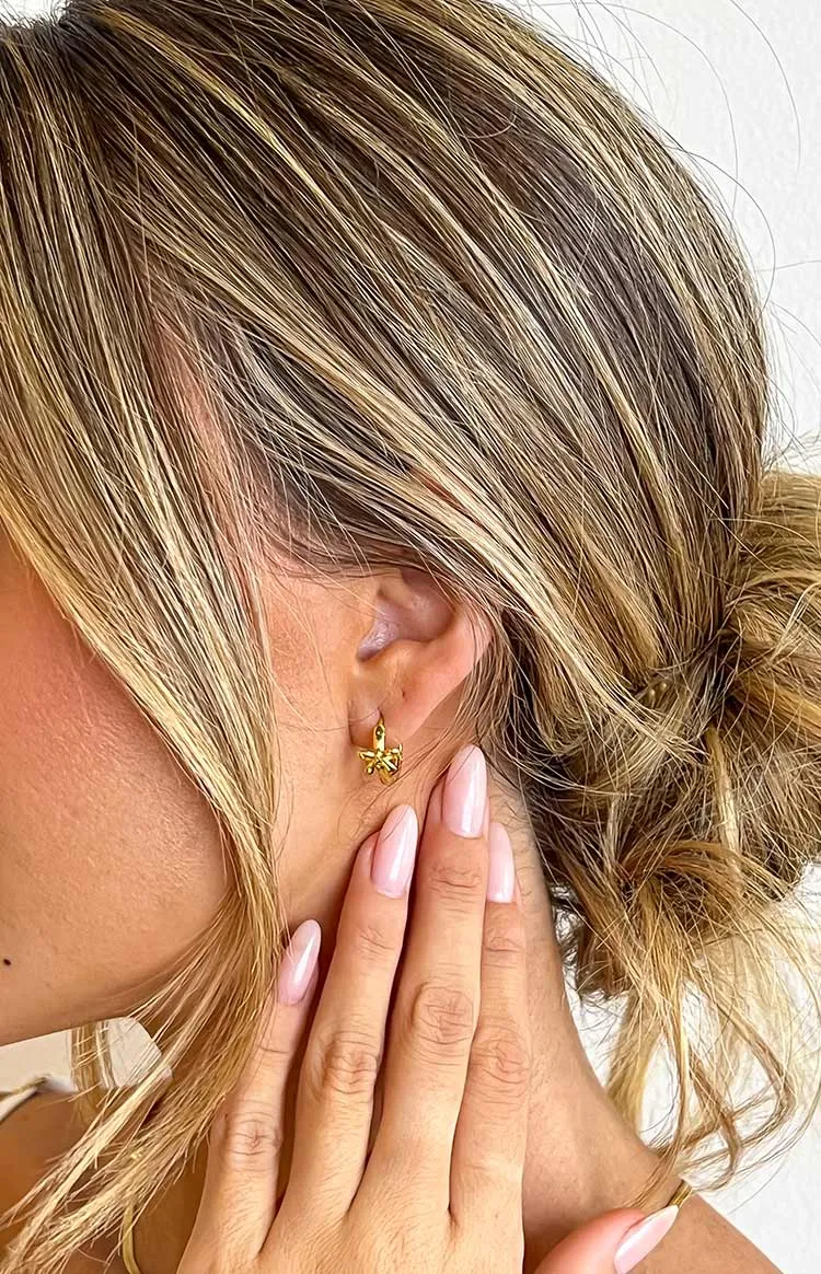 Darling Gold Bow Huggie Earrings sold by Beginning Boutique product image thumbnail 3
