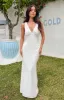 Vira White Maxi Dress sold by Beginning Boutique