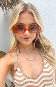 Go To Vintage Transparent Orange Sunglasses sold by Beginning Boutique