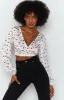 Zippy Wrap Blouse Floral sold by Beginning Boutique