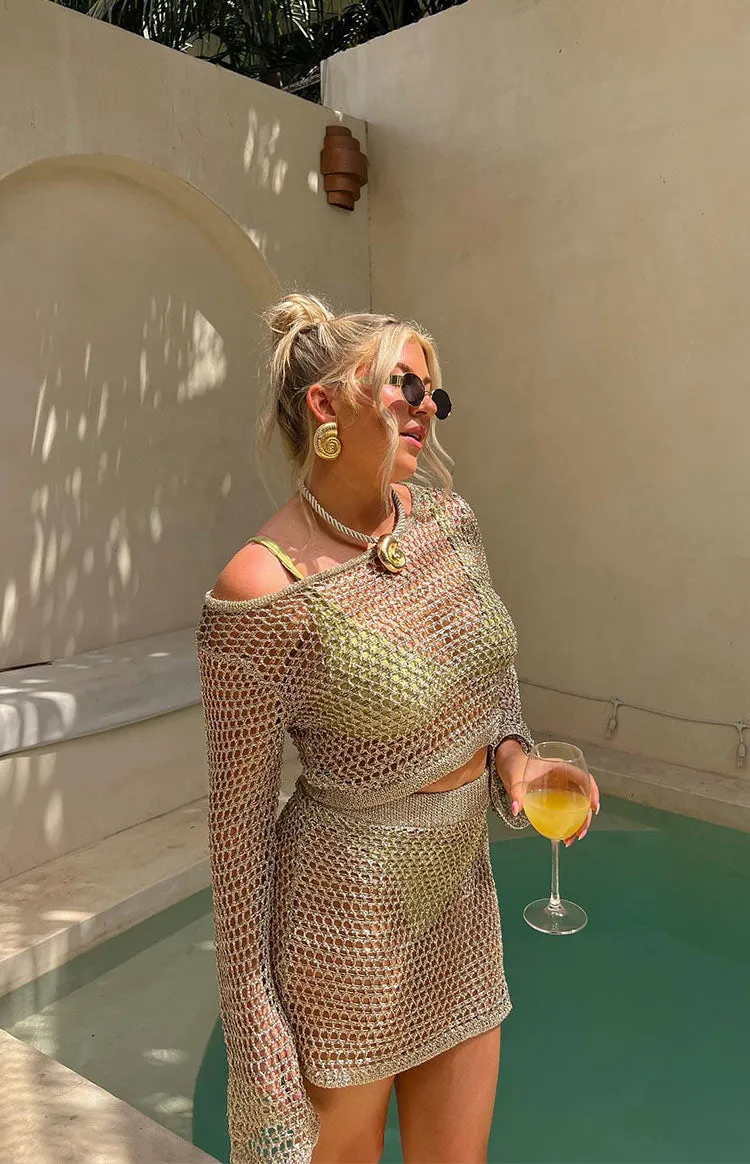 Wild Thoughts Gold Metallic Fishnet Mini Skirt sold by Beginning Boutique