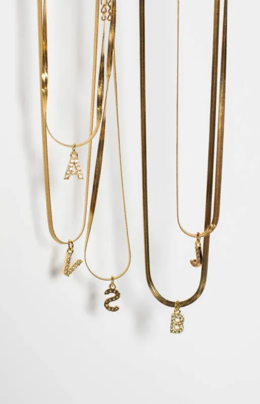 Camelia Gold Letter Snake Chain Necklace sold by Beginning Boutique