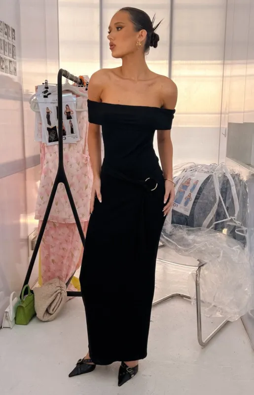 The Sophia Off The Shoulder Belt Black Maxi Dress sold by Beginning Boutique