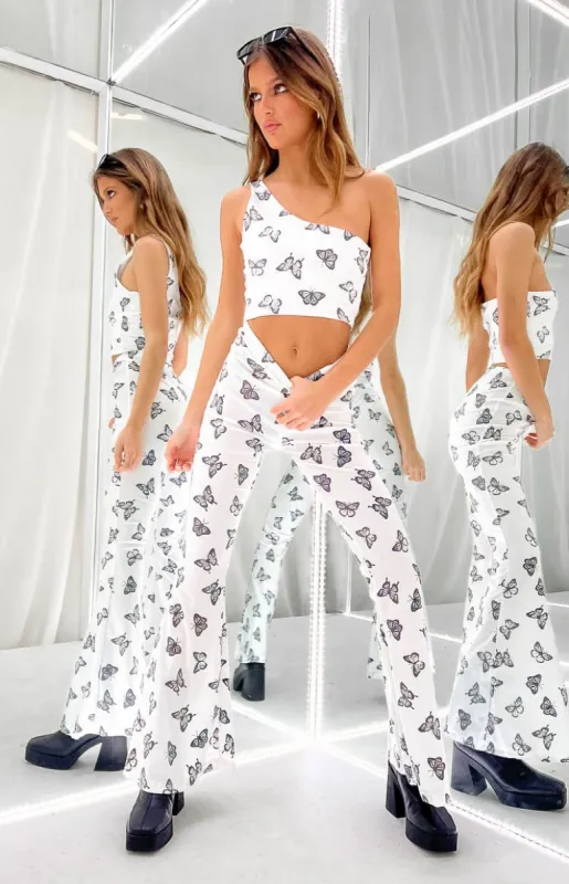The Volt Mimi White Butterfly Print Flare Pants sold by Beginning Boutique