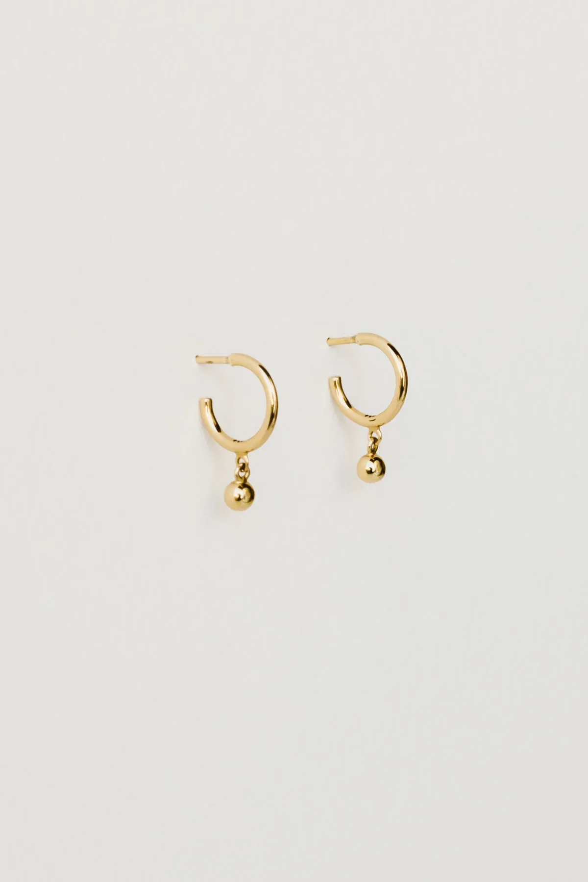 Ball Charm Hoops, Golden Brass sold by Naomi Murrell