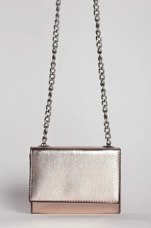 METALLIC CROSSBODY BAG sold by Deluxxie