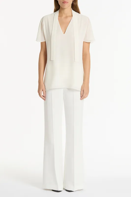CREAM GEORGETTE FLUTED TIE TOP sold by Carla Zampatti