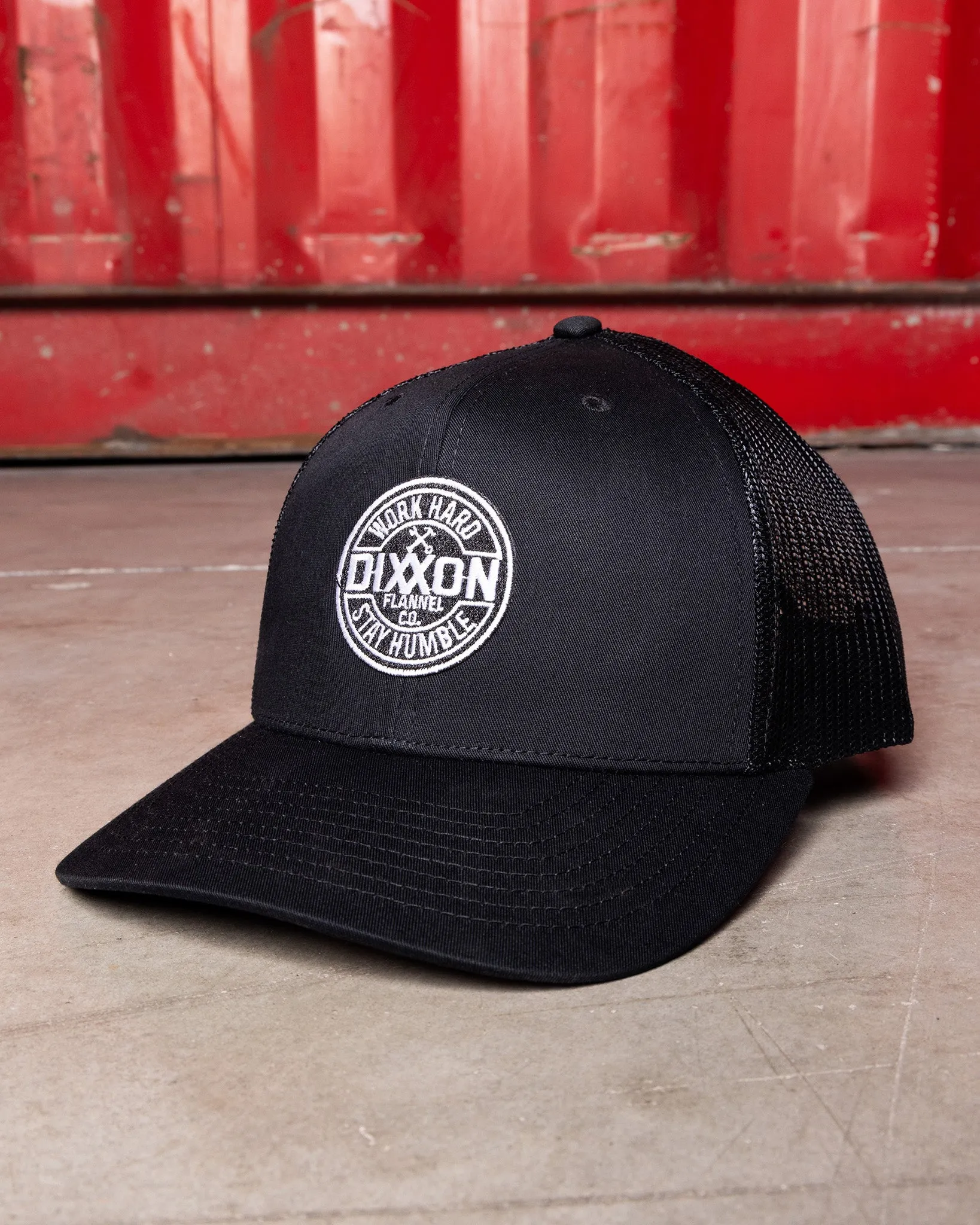 Corpo Curved Bill Trucker Snapback sold by Dixxon