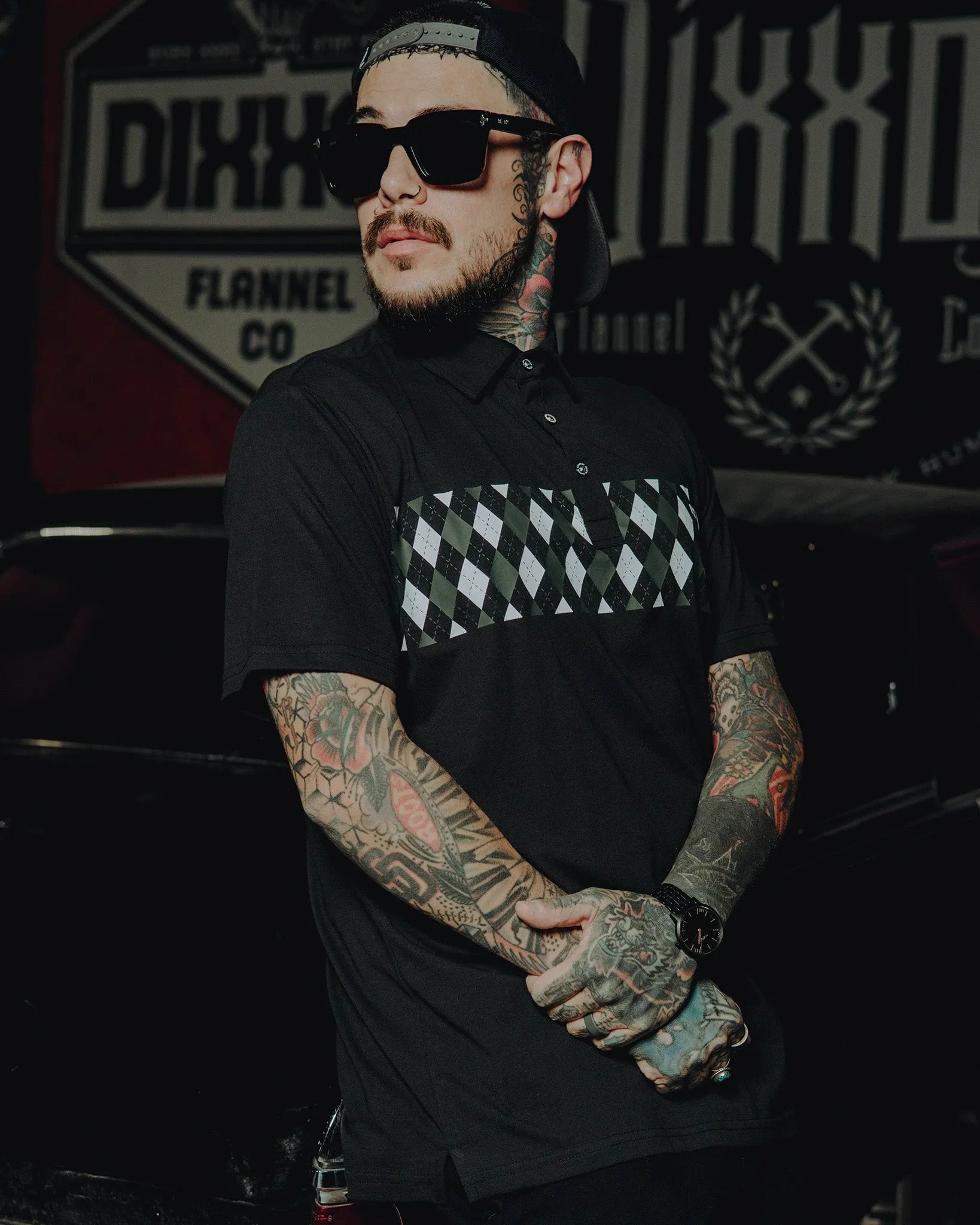 Black Argyle Premium Polo sold by Dixxon