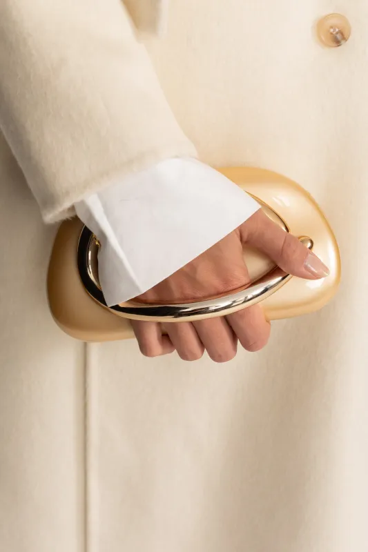 Clutch With Gold Sculptural Handle – Gold made by Sierra darien