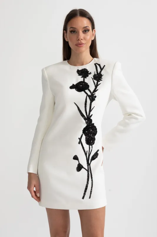 Long Sleeved Mini Dress With Contrasting Floral Embroidery - White made by Sierra darien