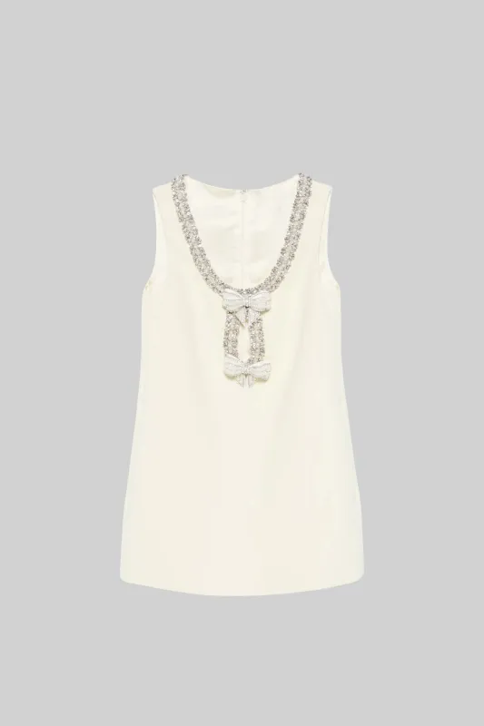 Sleeveless Mini Dress With Intricate Sparkling Neckline And Bow Embellishments - Ivoire made by Sierra darien