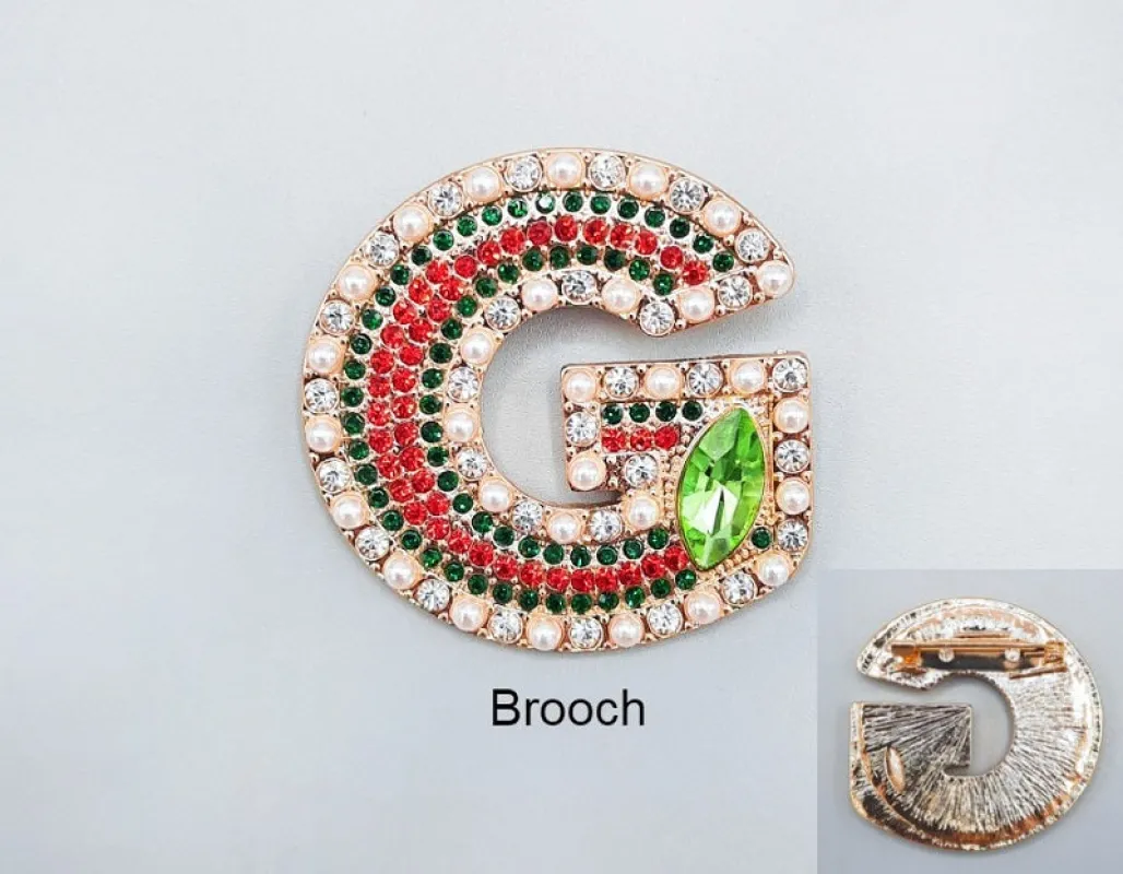 GOLD G BROOCH GREEN RED STONES ( 1004 GD ) sold by Oh My Jewelry