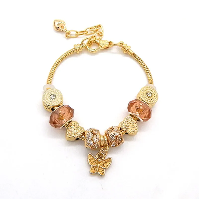 GOLD BEADED CHARM BRACELET WITH RHINESTONE BUTTERFLY CHARM ( 3058 GDCLR ) sold by Oh My Jewelry