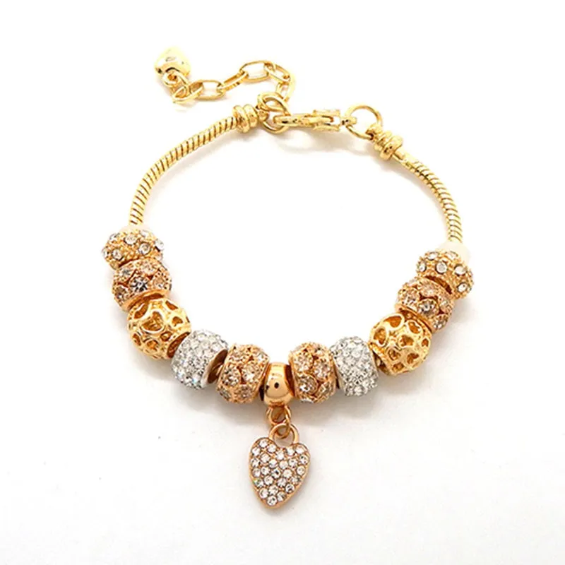 GOLD BEADED CHARM BRACELET WITH RHINESTONE HEART CHARM ( 3055 GDCLR ) sold by Oh My Jewelry