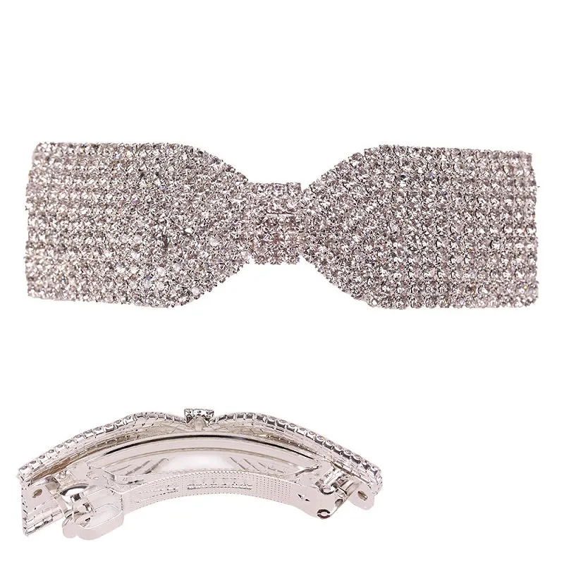 SILVER BOW HAIR CLIP CLEAR STONES ( 8695 S ) sold by Oh My Jewelry