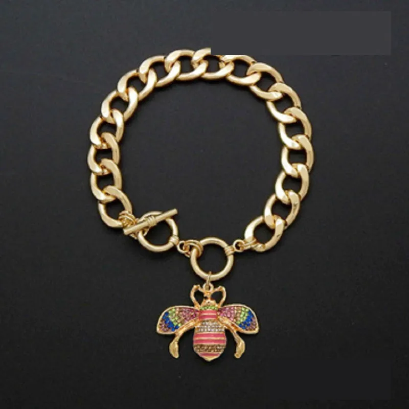 GOLD LIGHT MULTI COLOR RHINESTONE TOGGLE CHARM BRACELET ( 2210 GDLMT ) sold by Oh My Jewelry