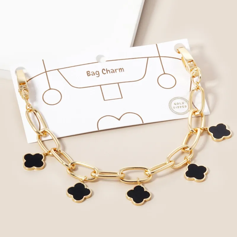 GOLD DIPPED BLACK QUATREFOIL BAG CHARM ( 353 GBK ) sold by Oh My Jewelry