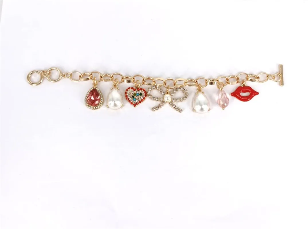 GOLD HEART LIP CHARM BRACLET ( 1385 GDMT ) sold by Oh My Jewelry