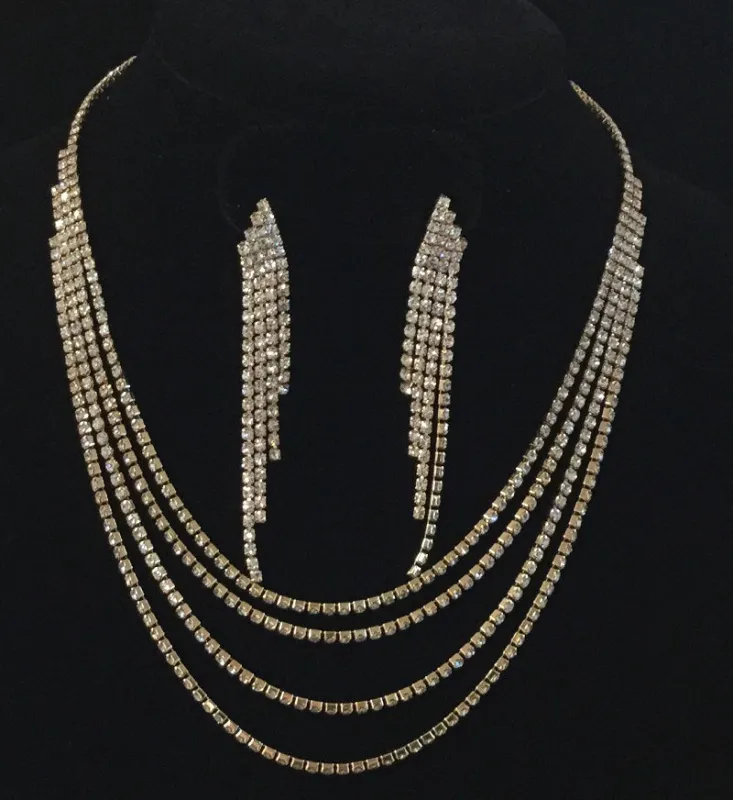 GOLD NECKLACE WITH CLEAR RHINESTONES AND MATCHING EARRINGS ( 0231 ) sold by Oh My Jewelry