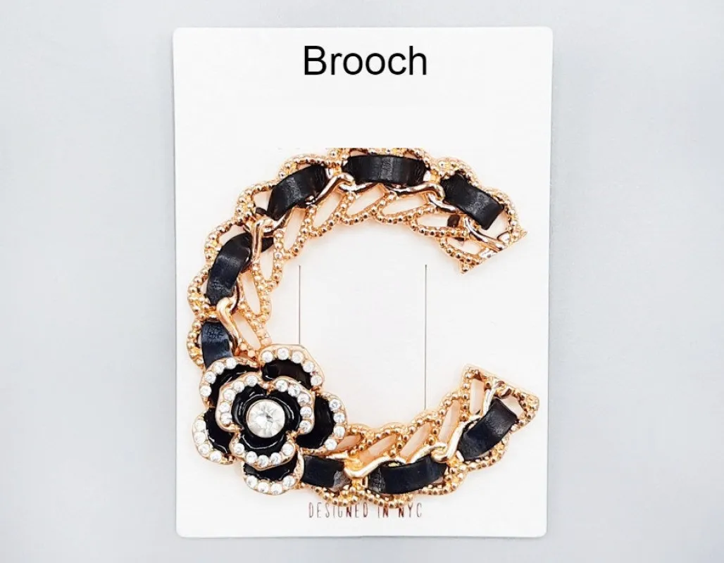 GOLD BLACK C BROOCH FLOWER CLEAR STONES ( 1015 GDBK ) made by Oh My Jewelry