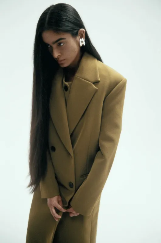 Long Egon Coat in Bonded Suiting sold by Harris Tapper