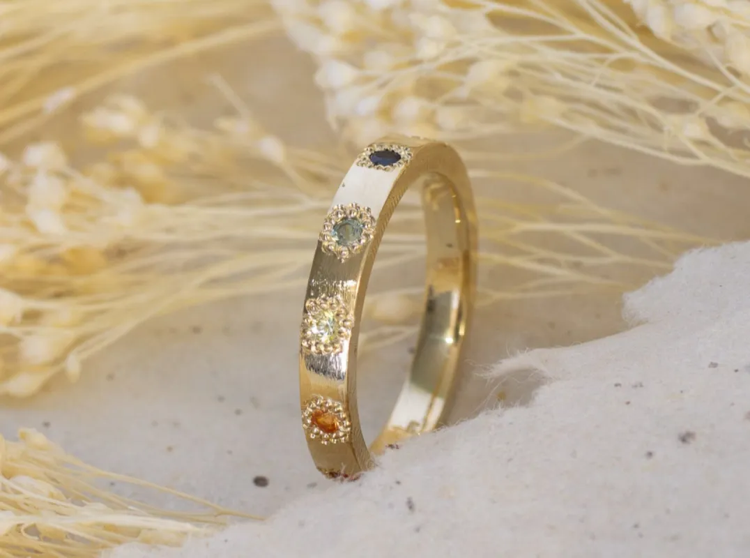 Rainbow Eternity Band - Yellow Gold with Sapphires sold by Sophie Divett Jewelry