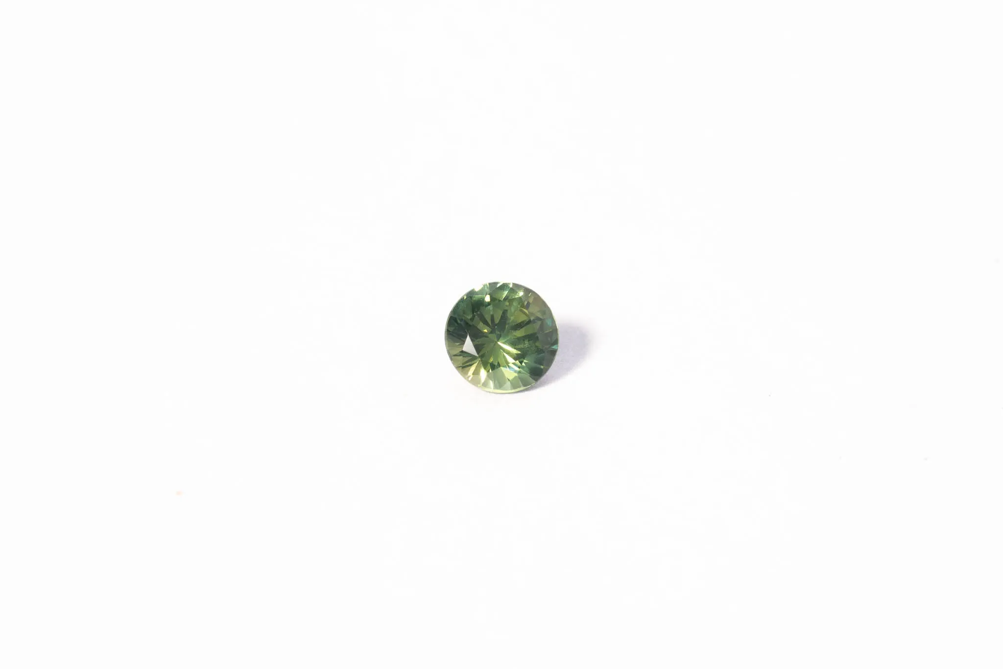 5.6mm Sapphire: 0.85ct Round - Green sold by Sophie Divett Jewelry