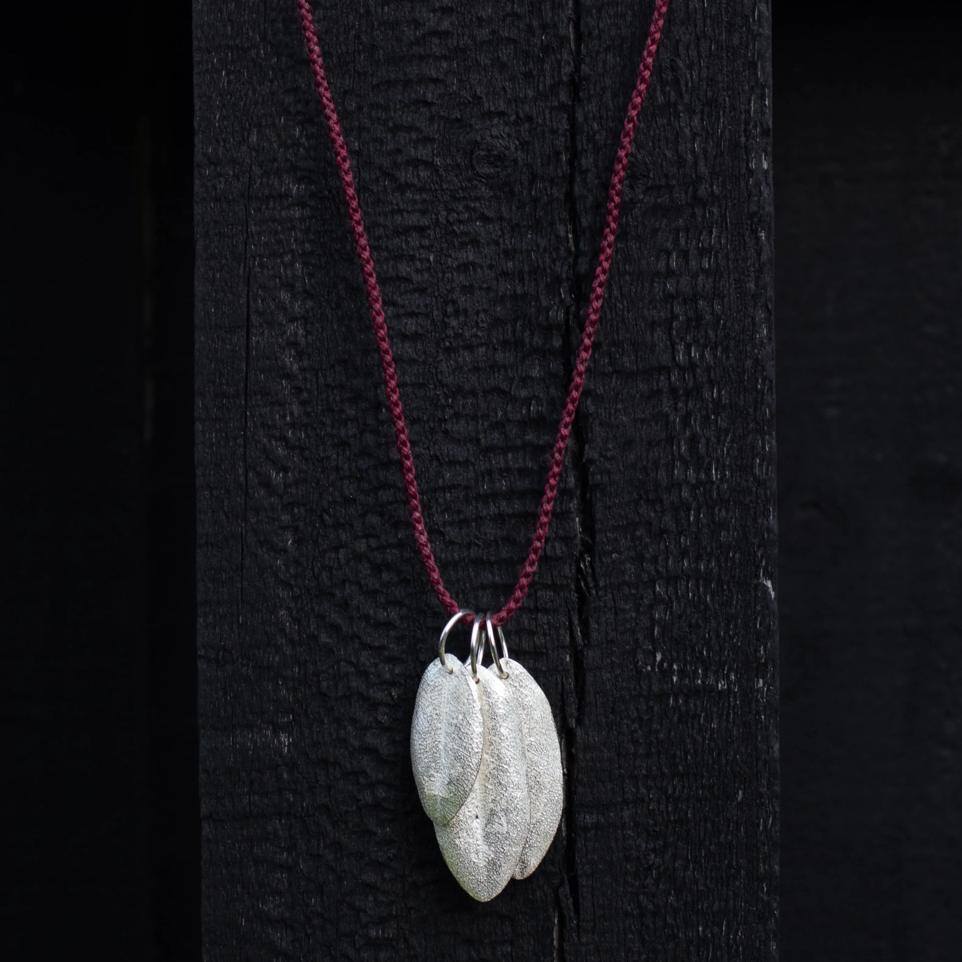 Three Leaf Charm Necklace on Braided Cord - Sterling Silver sold by Sophie Divett Jewelry